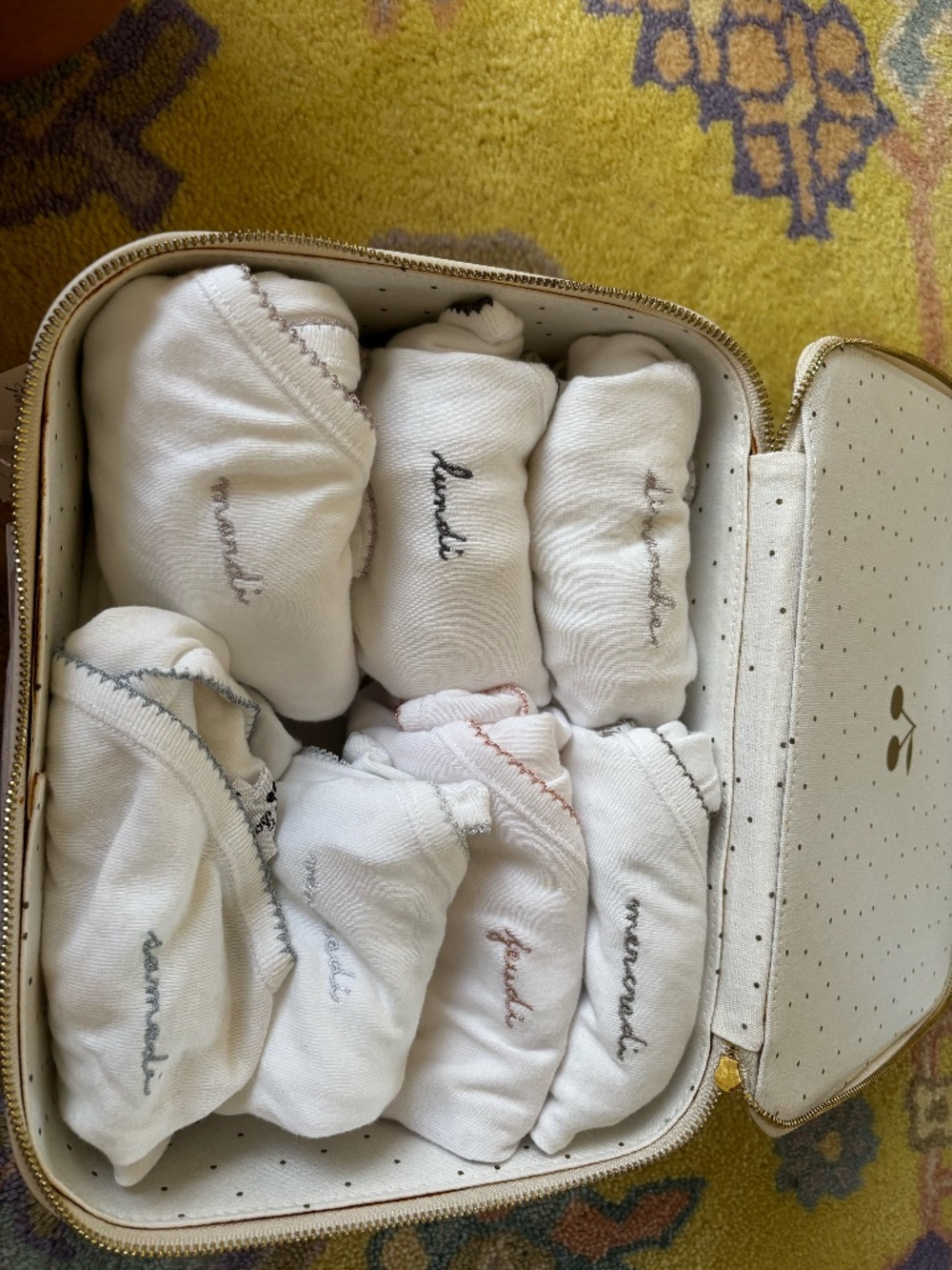 Bonpoint days of the week onesies and valise